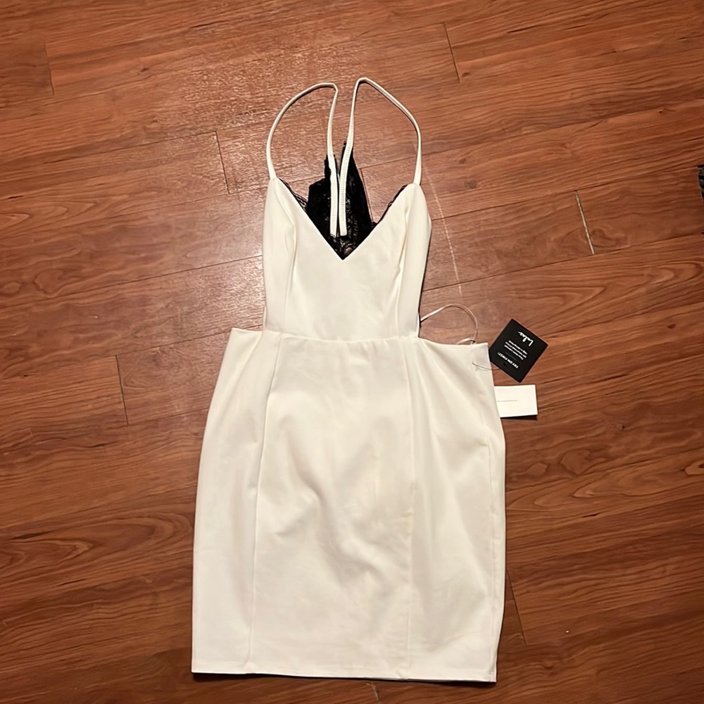 White v neck party dress with black back lace. New with tags